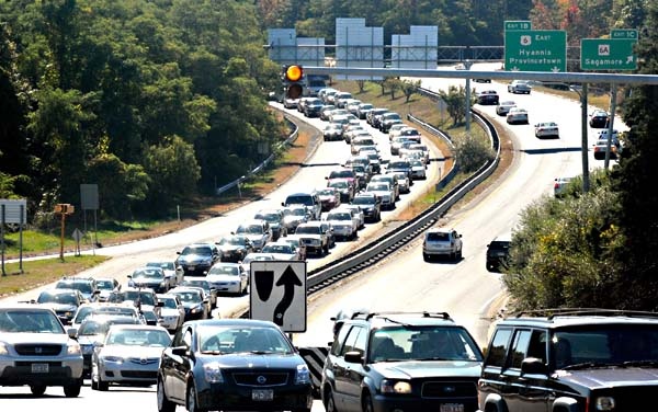 Cars sitting in traffic on the highway.